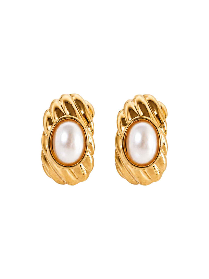 Pair of Dawn crystal pearl gold stud earrings on white background