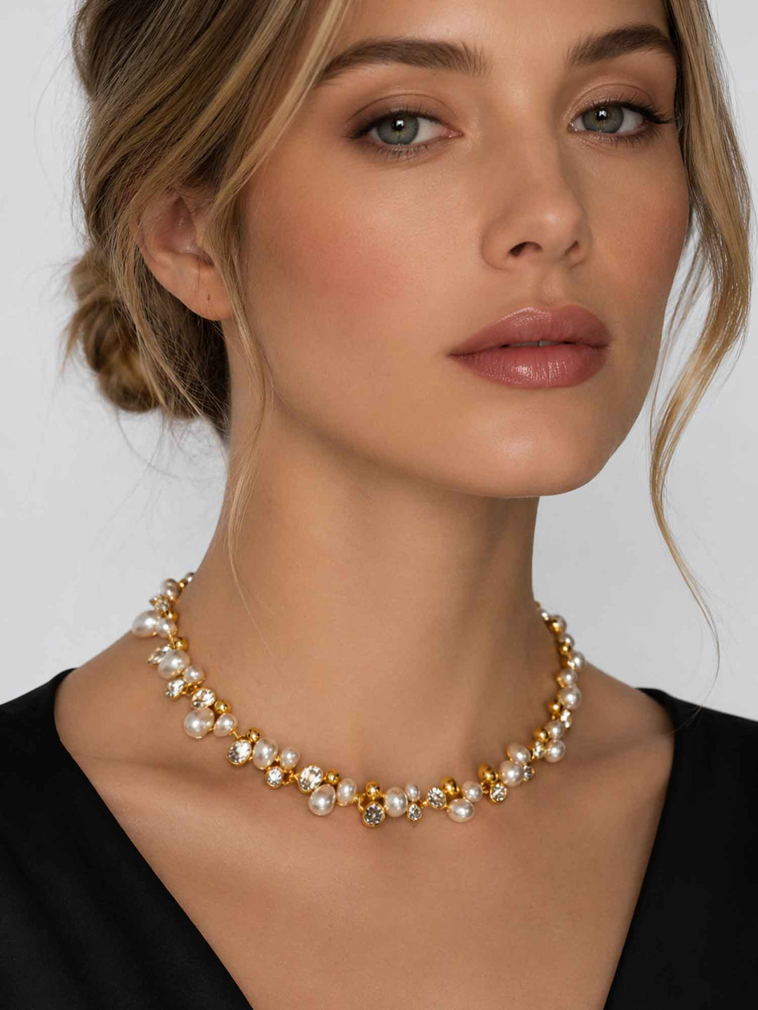 Model wearing Elspeth imitation pearl glass crystal necklace with black outfit