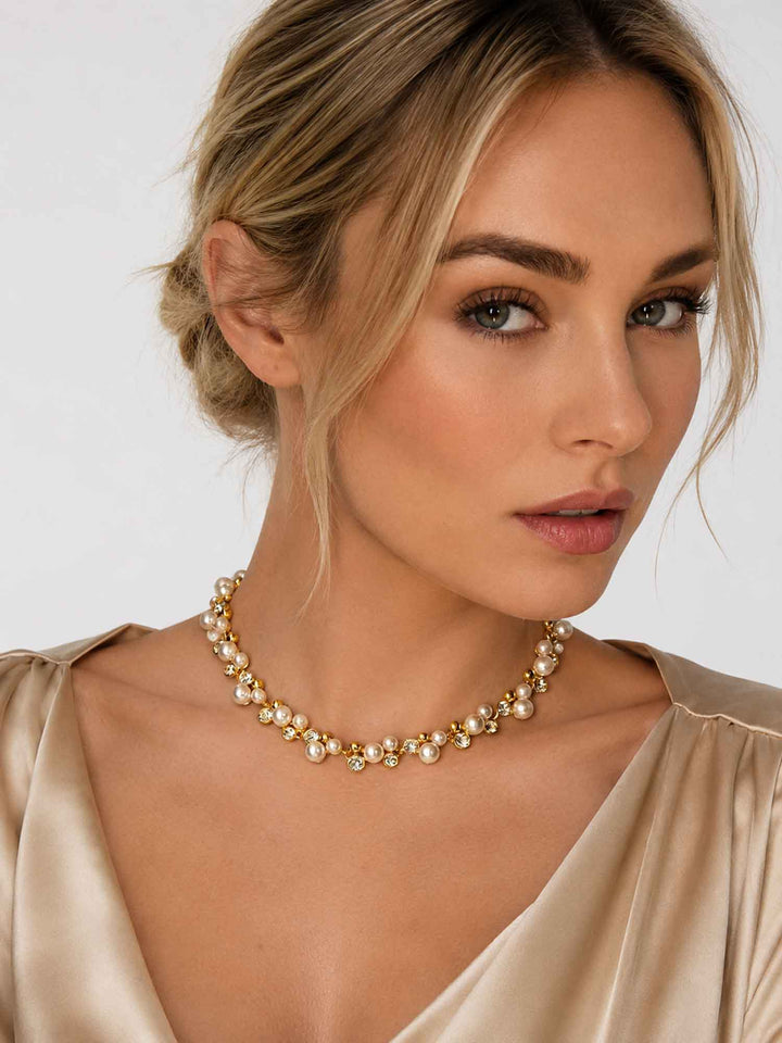 Model wearing Elspeth imitation pearl glass crystal necklace with light outfit