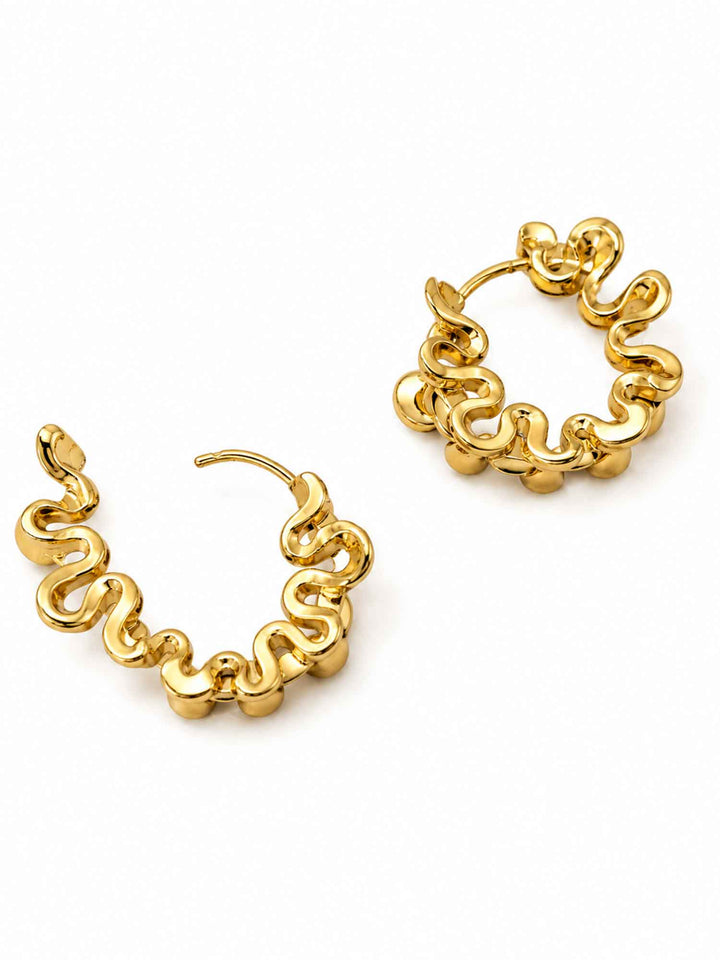Back view of Eudora black onyx gold huggie hoop earrings