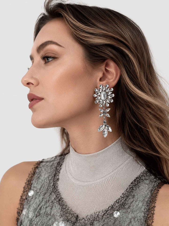 Model wearing Haven silver crystal pearl drop earrings with evening styling