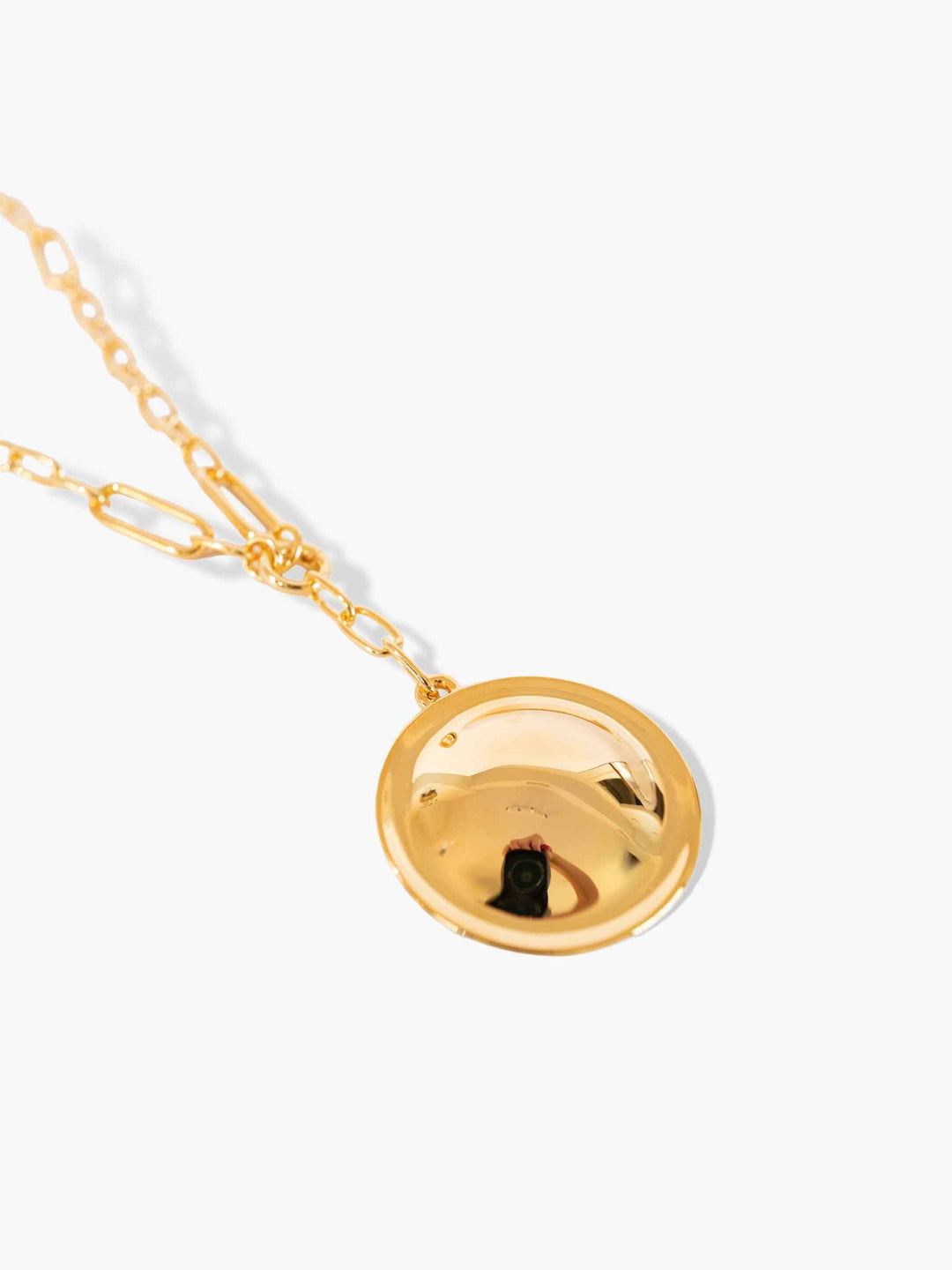 Detail view of Inez detachable round pendant gold necklace