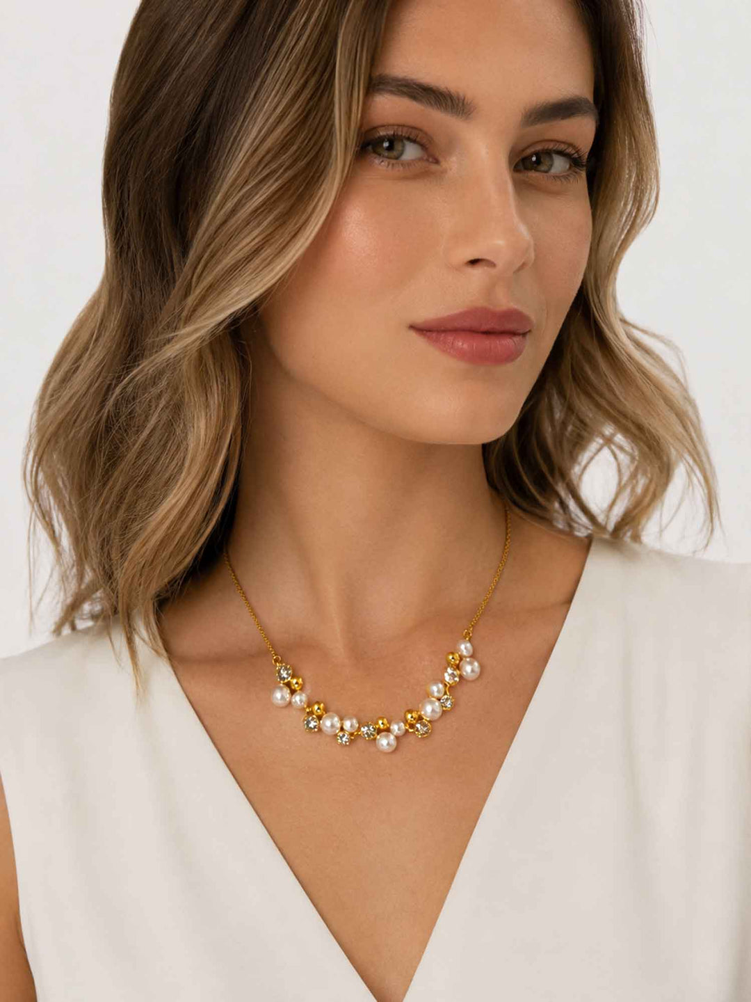 Close-up view of model wearing Jessamine crystal pearl cubic zirconia necklace