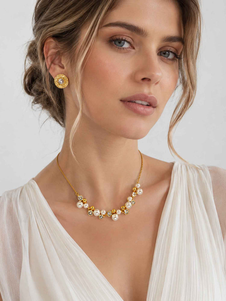 Model wearing Jessamine crystal pearl cubic zirconia necklace with white outfit