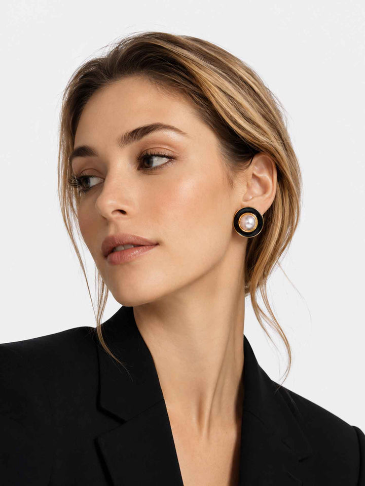 Side view of model wearing Kason black enamel pearl stud earrings