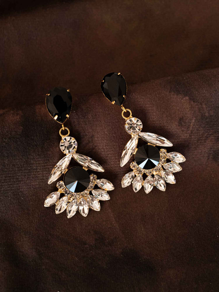 Maura black crystal fan drop earrings styled on dark fabric