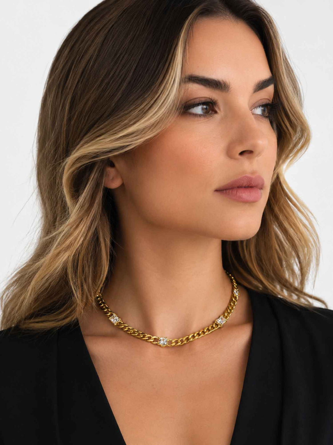 Close-up view of model wearing Mavia cubic zirconia gold chain necklace
