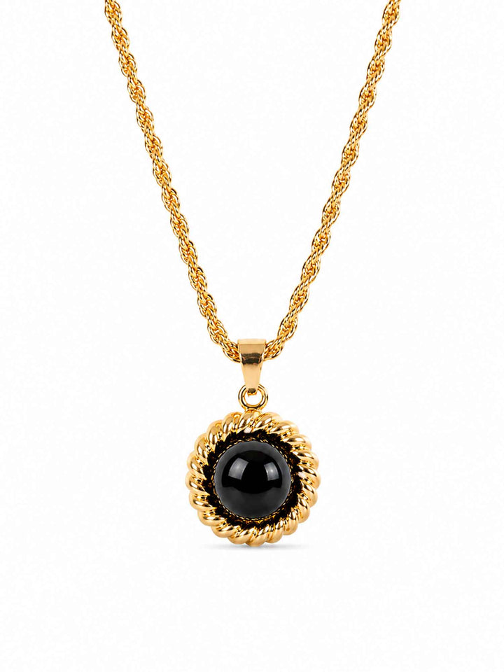 Melina black acrylic gold pendant necklace on white background