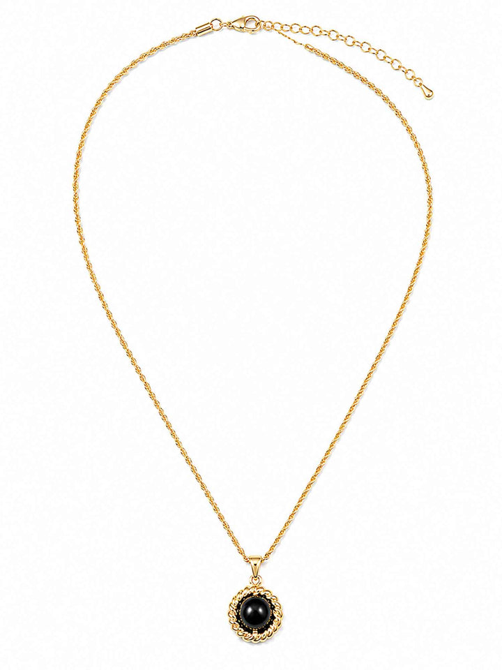 Full view of Melina black acrylic gold pendant necklace with adjustable chai