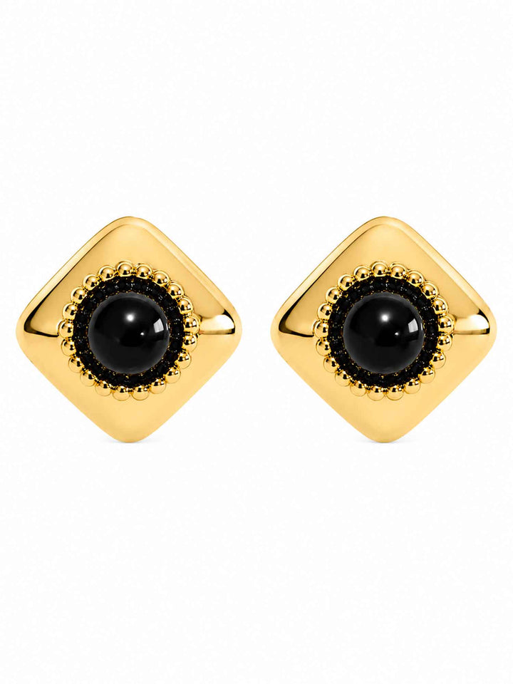 Pair of Melina Midnight black acrylic gold stud earrings on white background