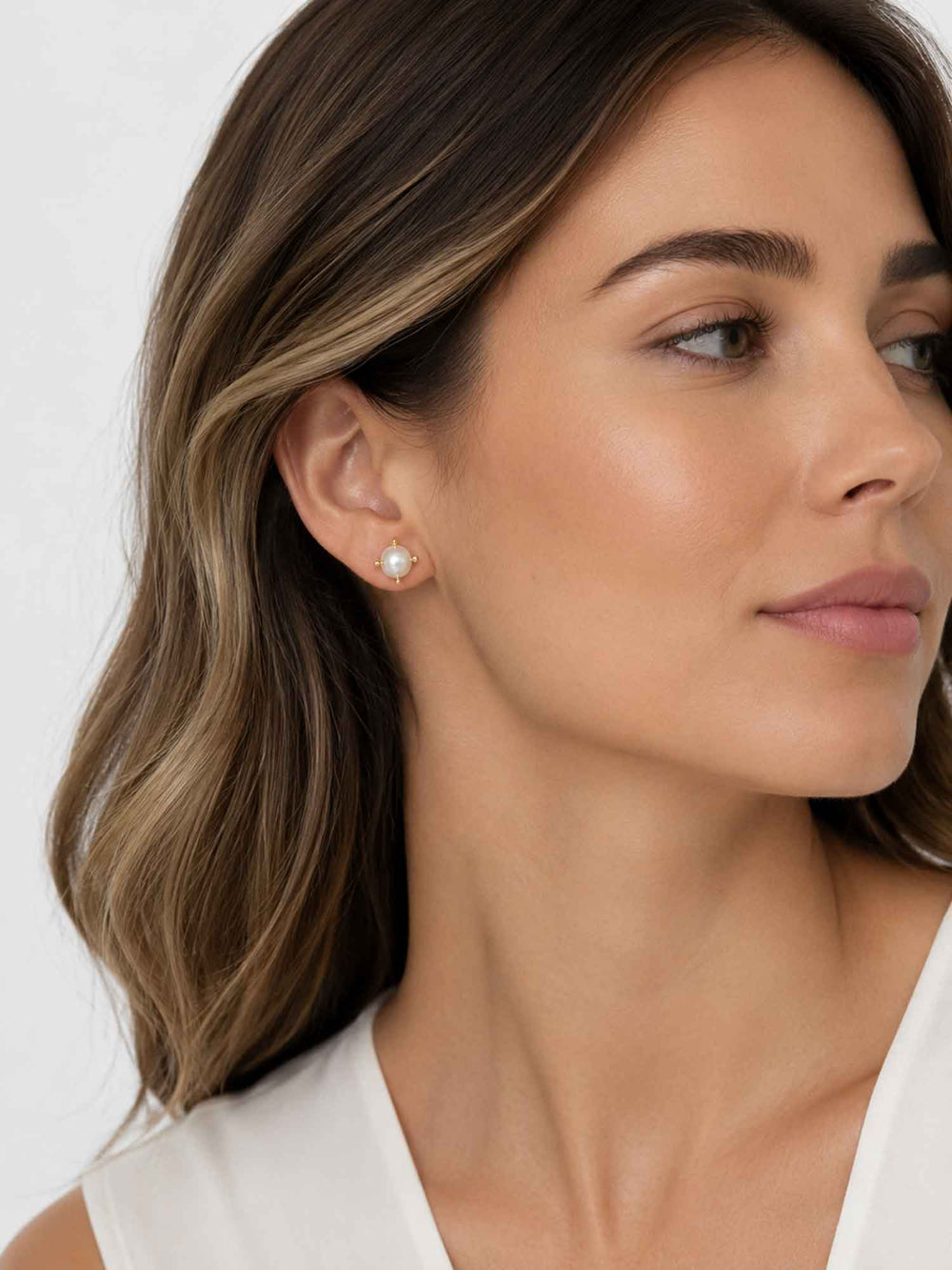 Side view of model wearing Nuala glass pearl stud earrings