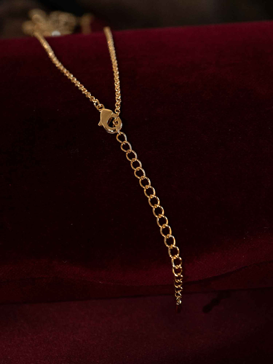 Back view of Olyssa beaded flower gold pendant necklace with adjustable extension chain