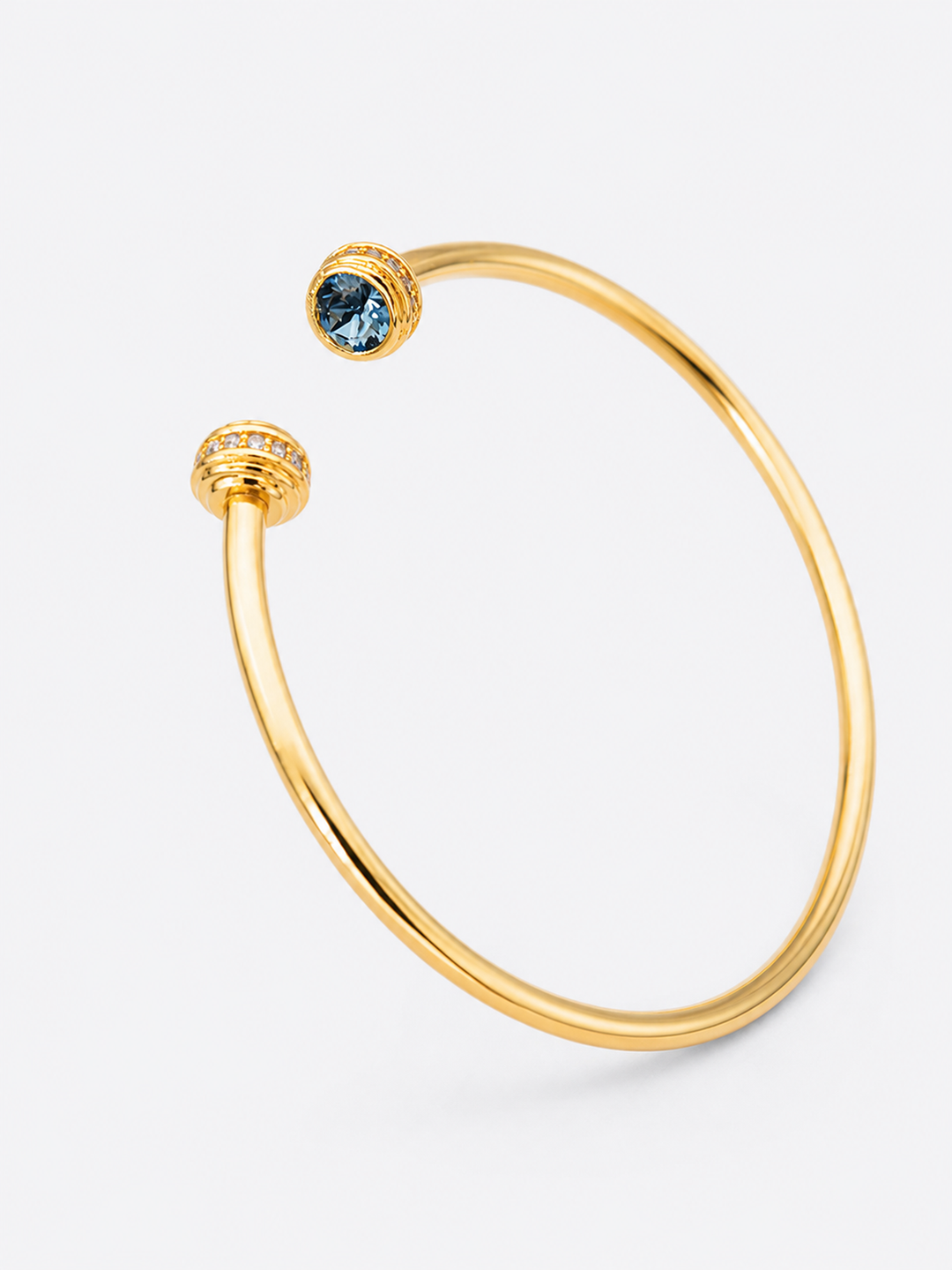 Detail view of Philippa gold cuff bracelet with blue stones