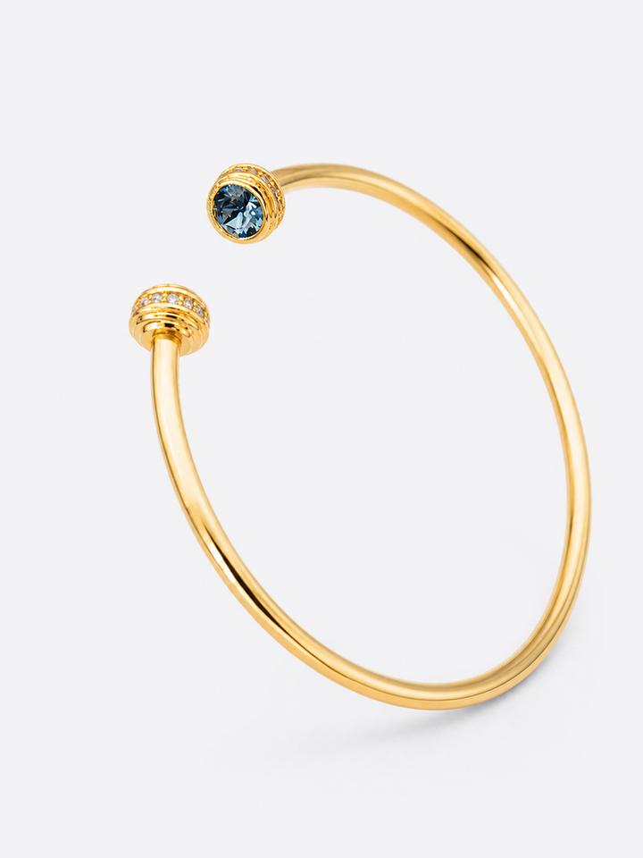 Detail view of Philippa gold cuff bracelet with blue stones