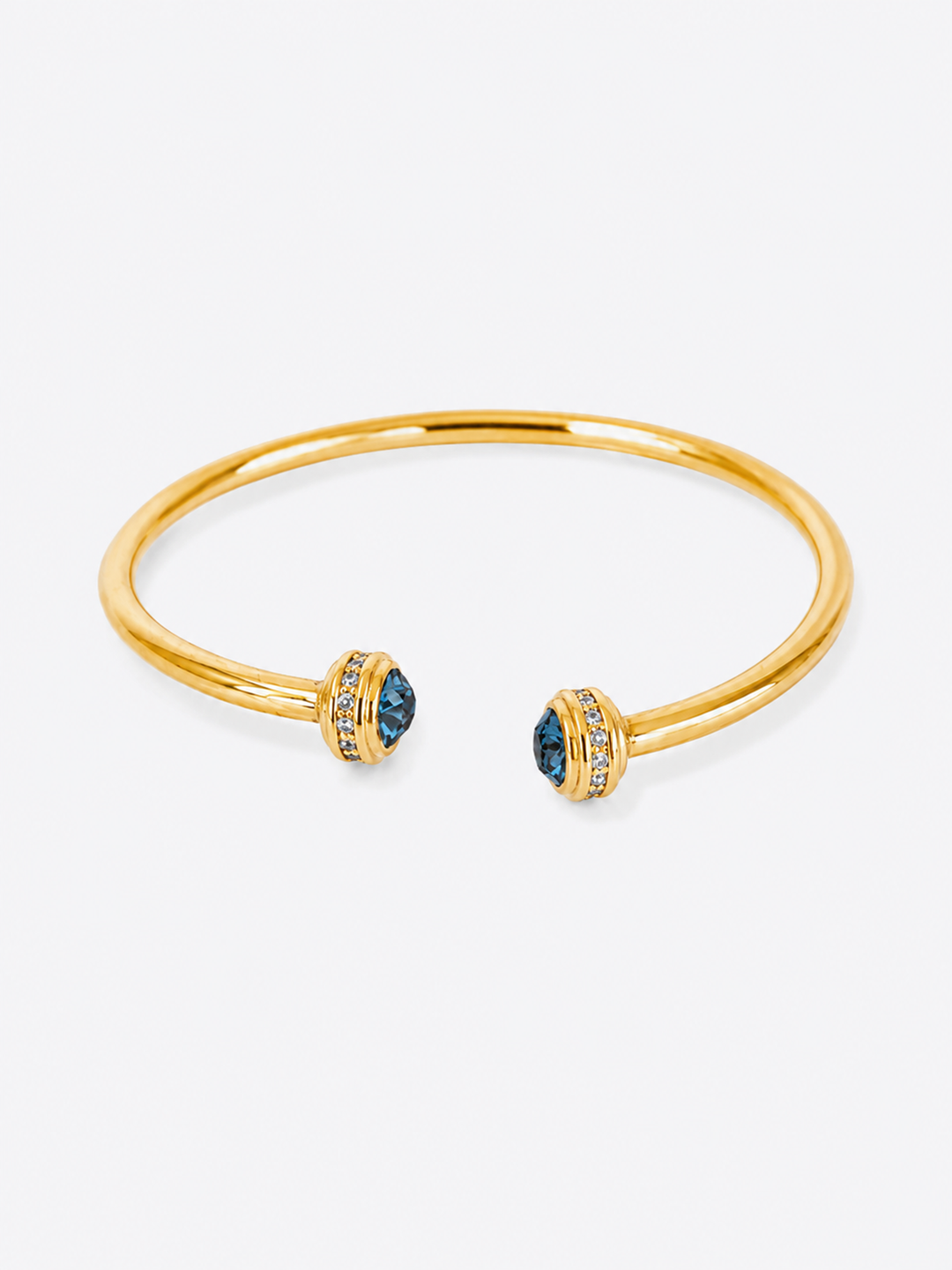 Philippa blue stone gold cuff bracelet on white background