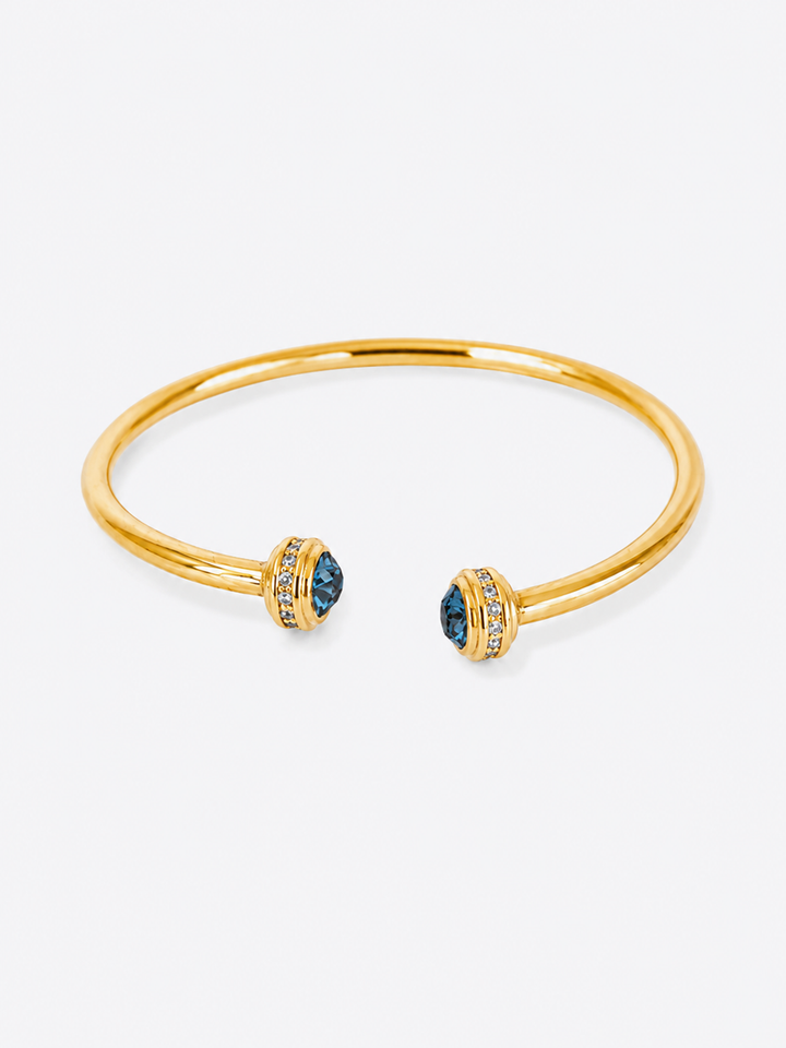 Philippa blue stone gold cuff bracelet on white background