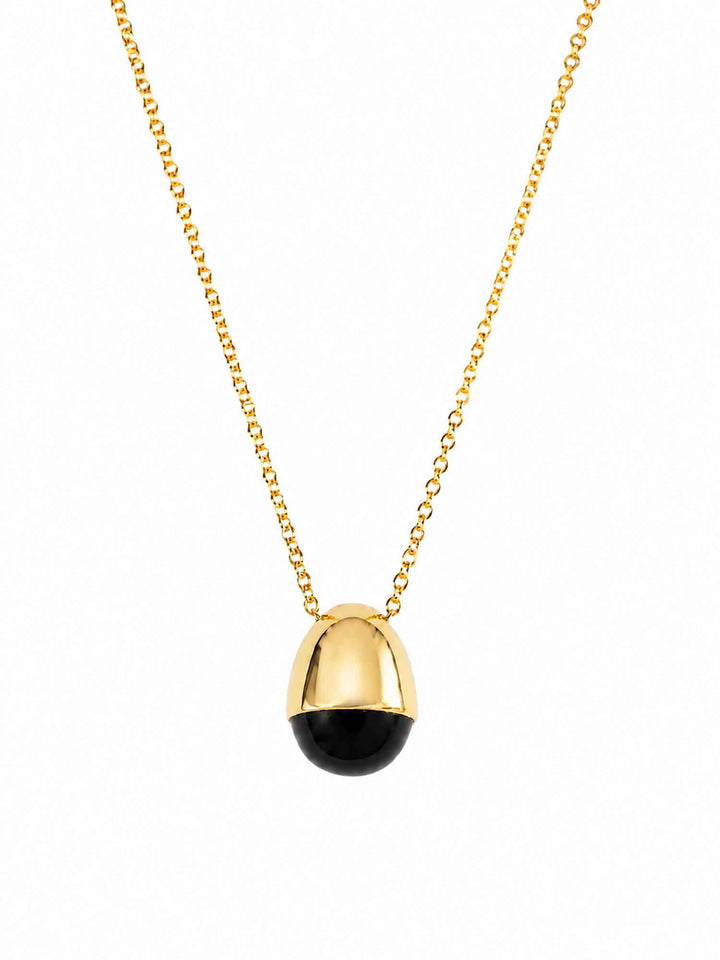 Renira black onyx gold pendant necklace on white background