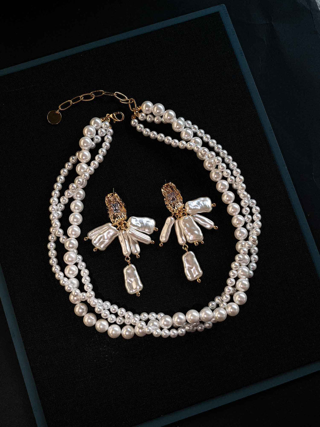 samira-baroque-pearl-drop-earrings-model-side