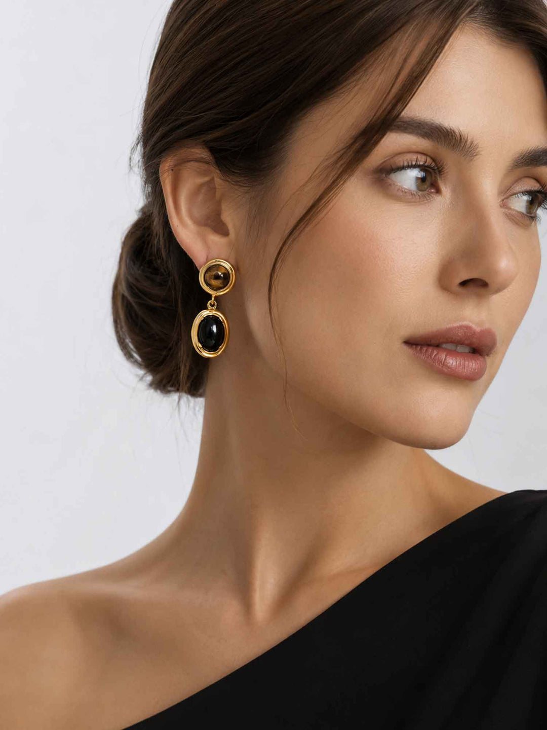 Model wearing Spectral tiger eye and obsidian drop earrings with elegant styling