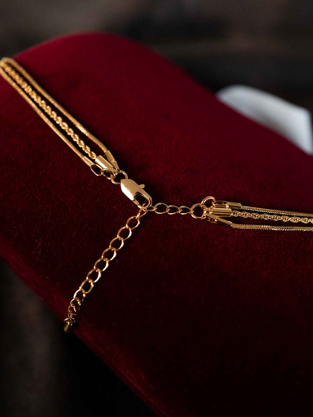Back view of Thesira layered gold chain necklace with adjustable extension chain
