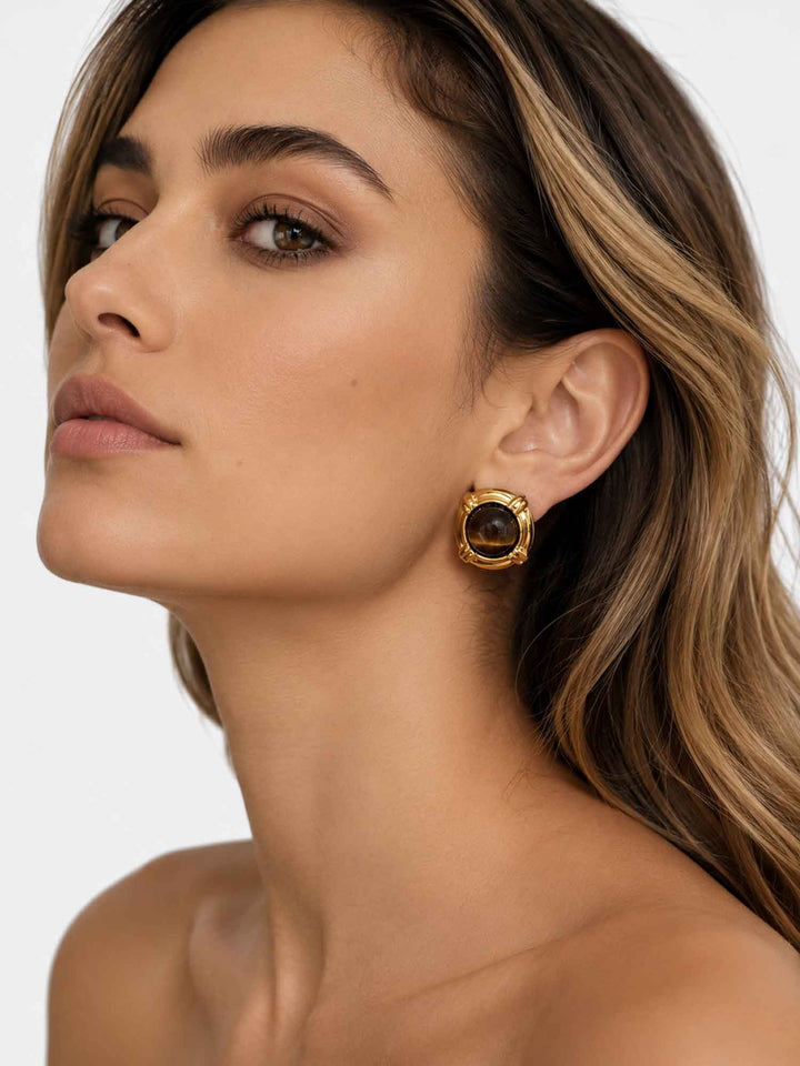 Model wearing tiger eye stone gold stud earrings with a polished everyday look