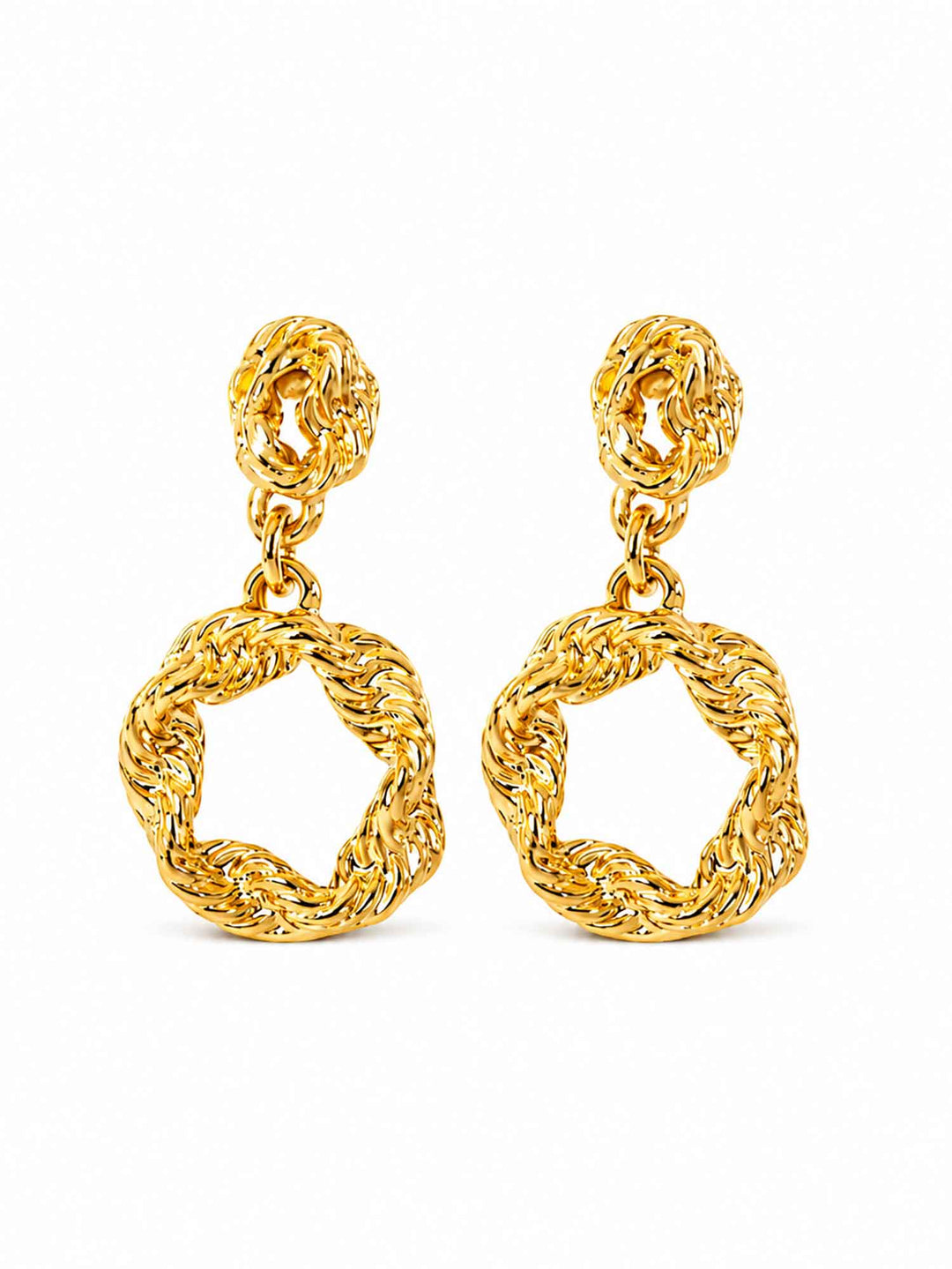 Pair of twisted gold hoop drop earrings on white background