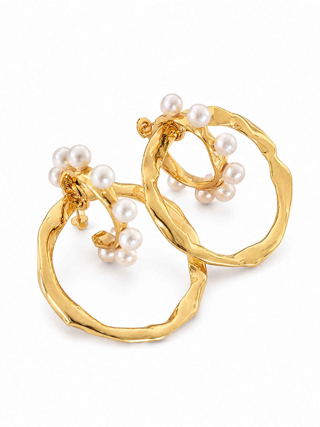 Detail view of two-way cotton pearl gold hoop earrings