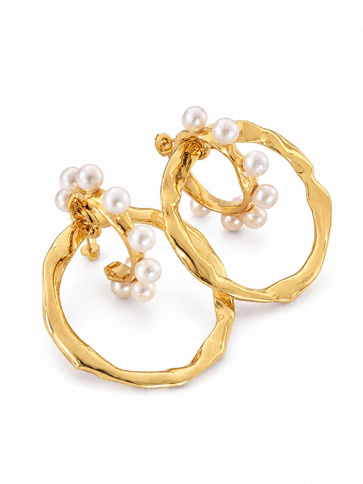 Detail view of two-way cotton pearl gold hoop earrings