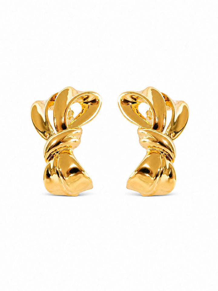 Pair of Zaya sculptural gold ribbon stud earrings on white background